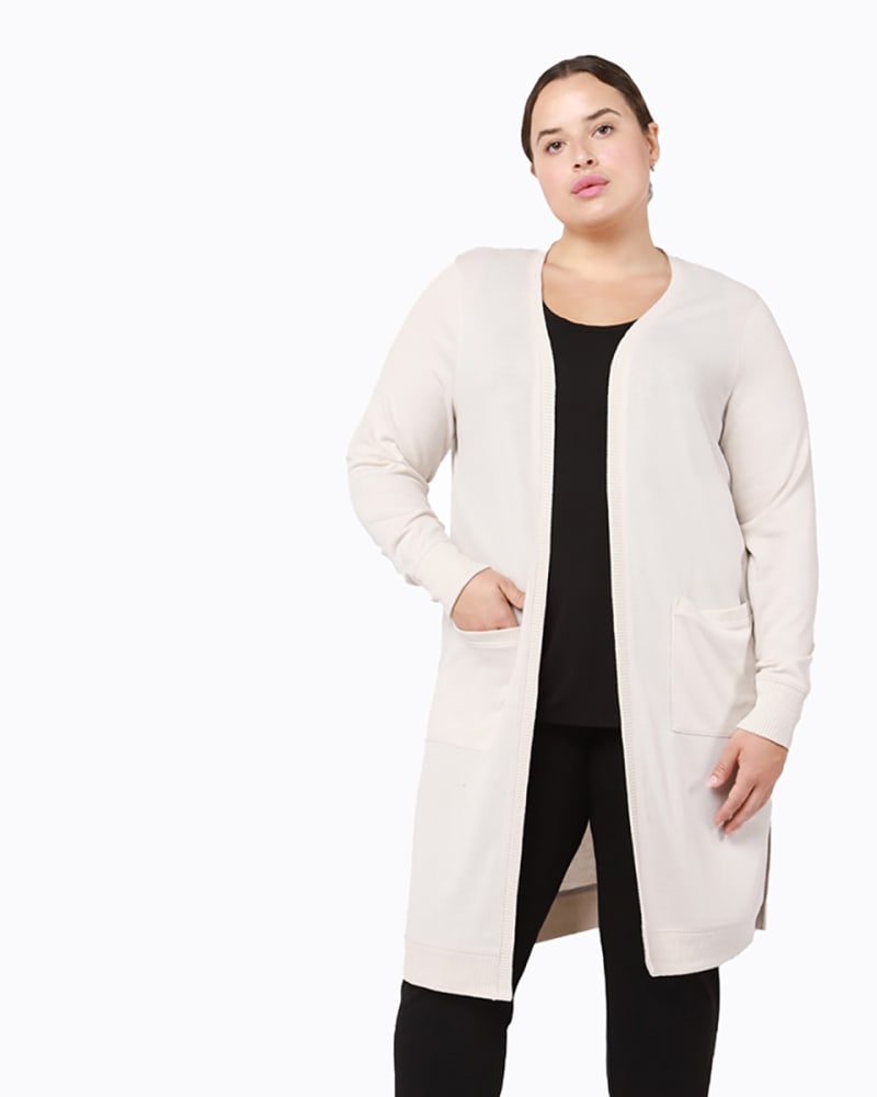 Front of a model wearing a size 0X Julissa Longline Pocket Cardigan in Beige by DEX PLUS. | dia_product_style_image_id:235435